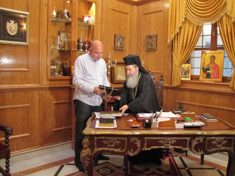 His Beatitude presenting a gift to the Minister
