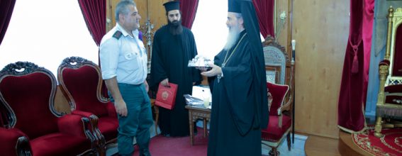 His Beatitude offering a commemorative gift to Mr Mansour