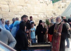 Father Issa blessing the waters on the open-air altar