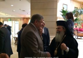 His Beatitude greets guests at lunch