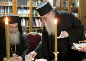 His Beatitude with Monk Photios during the cutting of St Basil’s Cake in 2014